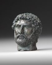 A MINIATURE BRONZE HEAD OF THE EMPEROR HADRIAN, 117-138 AD 2ND CENTURY AD