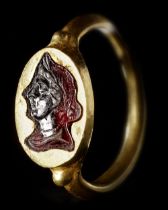 A ROMAN GOLD RING WITH PORTRAIT GARNET INTAGLIO, CIRCA 1ST CENTURY B.C, 1ST CENTURY A.D.