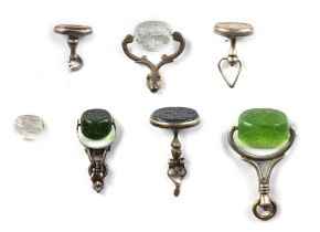 A GROUP OF SILVER MOUNT JADE, AGATE AND ROCK CRYSTAL STAMPS AND SEALS, PERSIA, QAJAR, 19TH-EARLY 20T