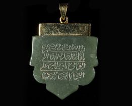 A JADE CARVED TALISMANIC PENDANT