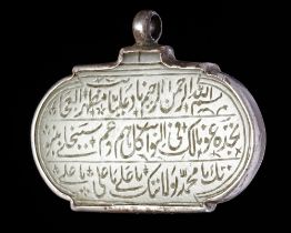 AN OVAL SAFAVID JADE TALISMANIC PENDANT