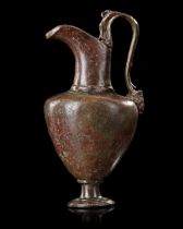 A ROMAN BEAKED JUG WITH FIGURAL HANDLE, CIRCA 1ST CENTURY AD