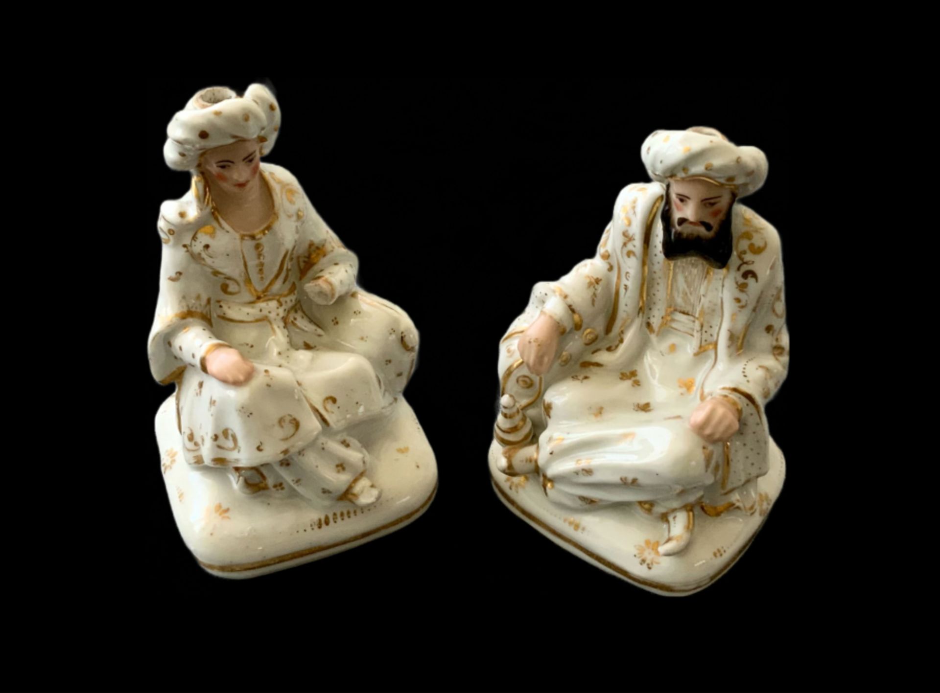 Two porcelain Sultan and Sultana container models 