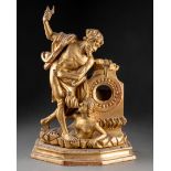 PORTE-MONTRE figurant l'allégorie du temps Bois sculpté et doré Epoque XVIIIe siècle H. 36 cm - L.