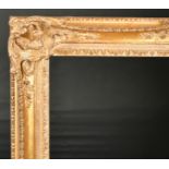 John Davies Framing. A Reproduction Carved Giltwood Louis XV Style Frame, with swept centres and