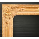 John Davies Framing. A Reproduction Carved Giltwood Louis XIV Style Frame, with swept centres and