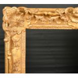 Early 20th Century French School. A Carved Giltwood Louis XV Style Frame, with swept and pierced