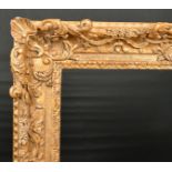 John Davies Framing. A Reproduction Carved Giltwood Louis XIV Style Frame, with swept and pierced