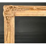 John Davies Framing. A Reproduction Carved Giltwood Louis XV Style Frame, with swept centres and