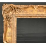 John Davies Framing. A Reproduction Carved Giltwood Louis XV Style Frame, with swept and pierced