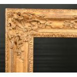 19th Century French School. A Carved Giltwood Louis XIV Style Giltwood Frame, with swept centres and