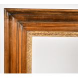 John Davies Framing. A Reproduction Darkwood Two Part Teniers Frame with a Carved Giltwood inner