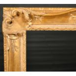 John Davies Framing. A Reproduction Carved Giltwood Louis XV Style Frame, with swept and pierced