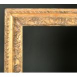 17th Century English School. A Carved Giltwood Lely Finger Panel Frame, rebate 44" x 28.5" (111.8