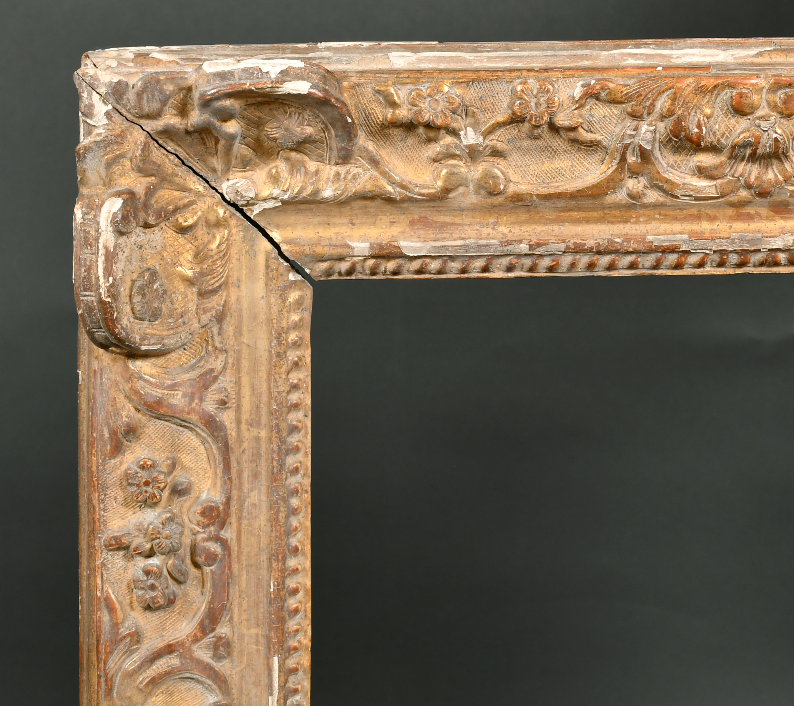 18th Century French School. A Carved Giltwood Louis XIV Giltwood Frame, with swept centres and