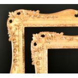 18th Century English School. A Pair of Carved Giltwood Frames, with swept and pierced centres and