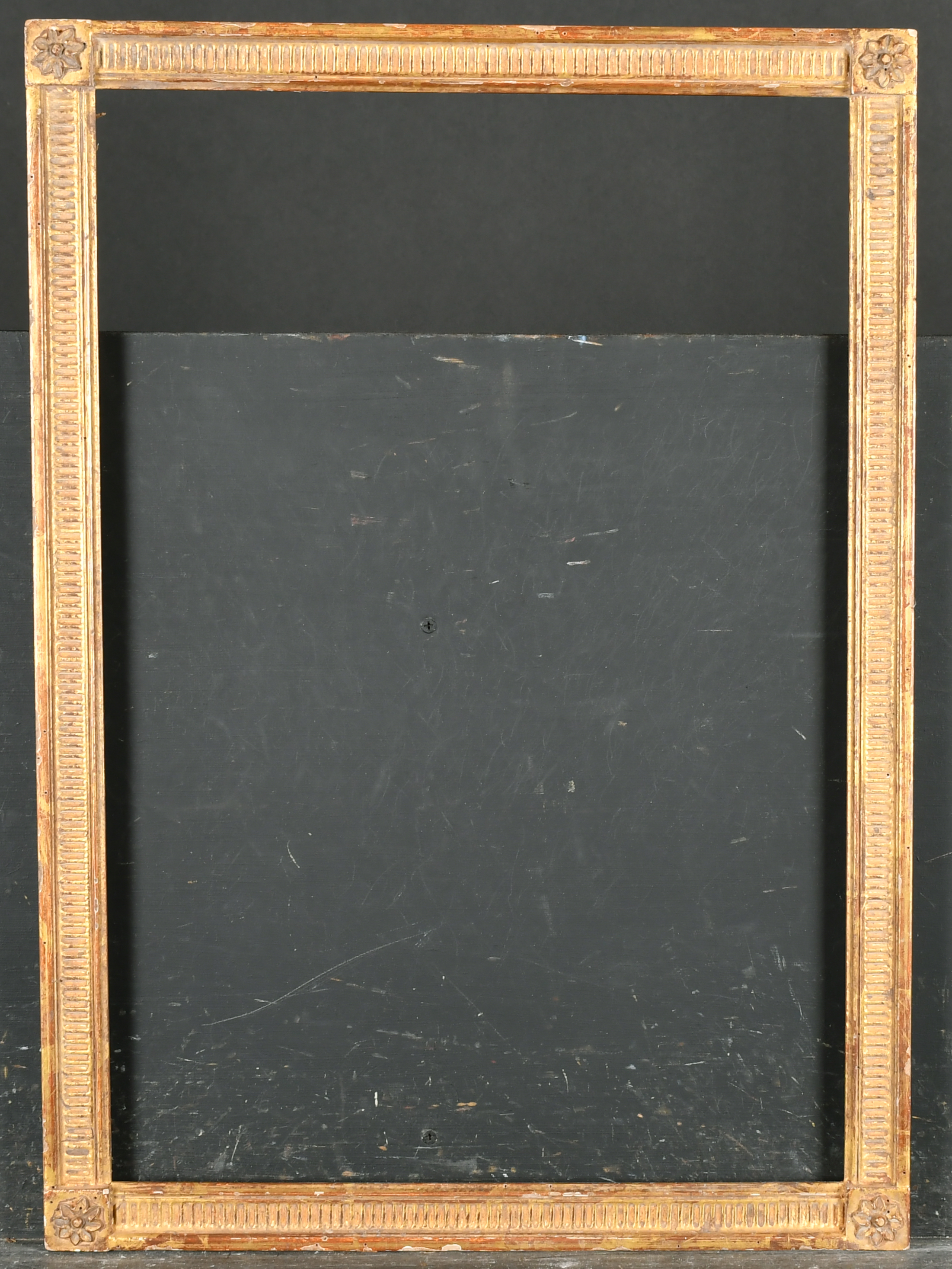 20th Century French School. A Louis Style Giltwood Frame, with flutes and paterae corners, rebate - Image 2 of 3