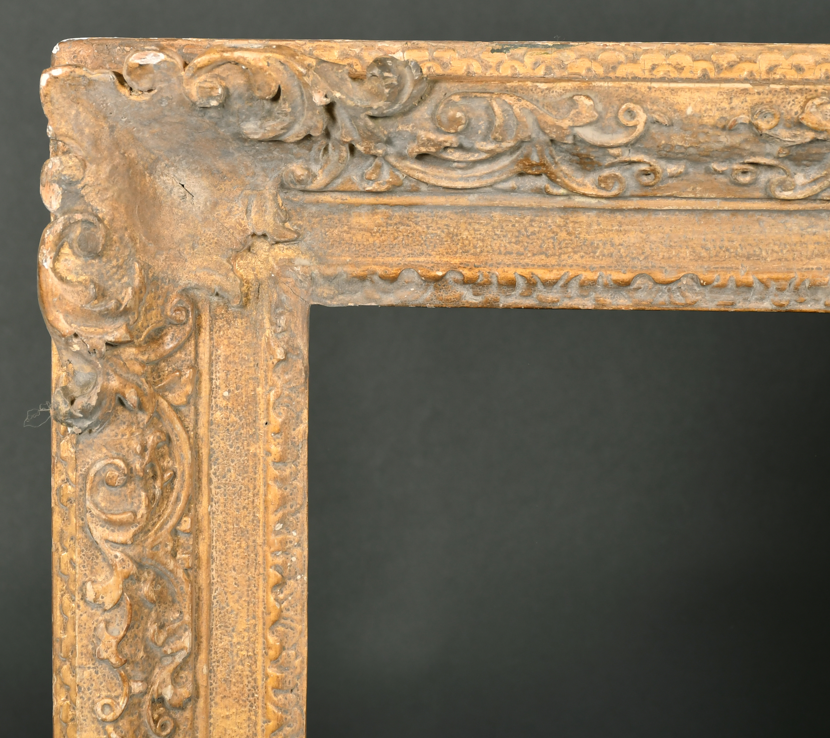 Early 18th Century English School. A Carved Giltwood Frame, with swept centres and corners, rebate