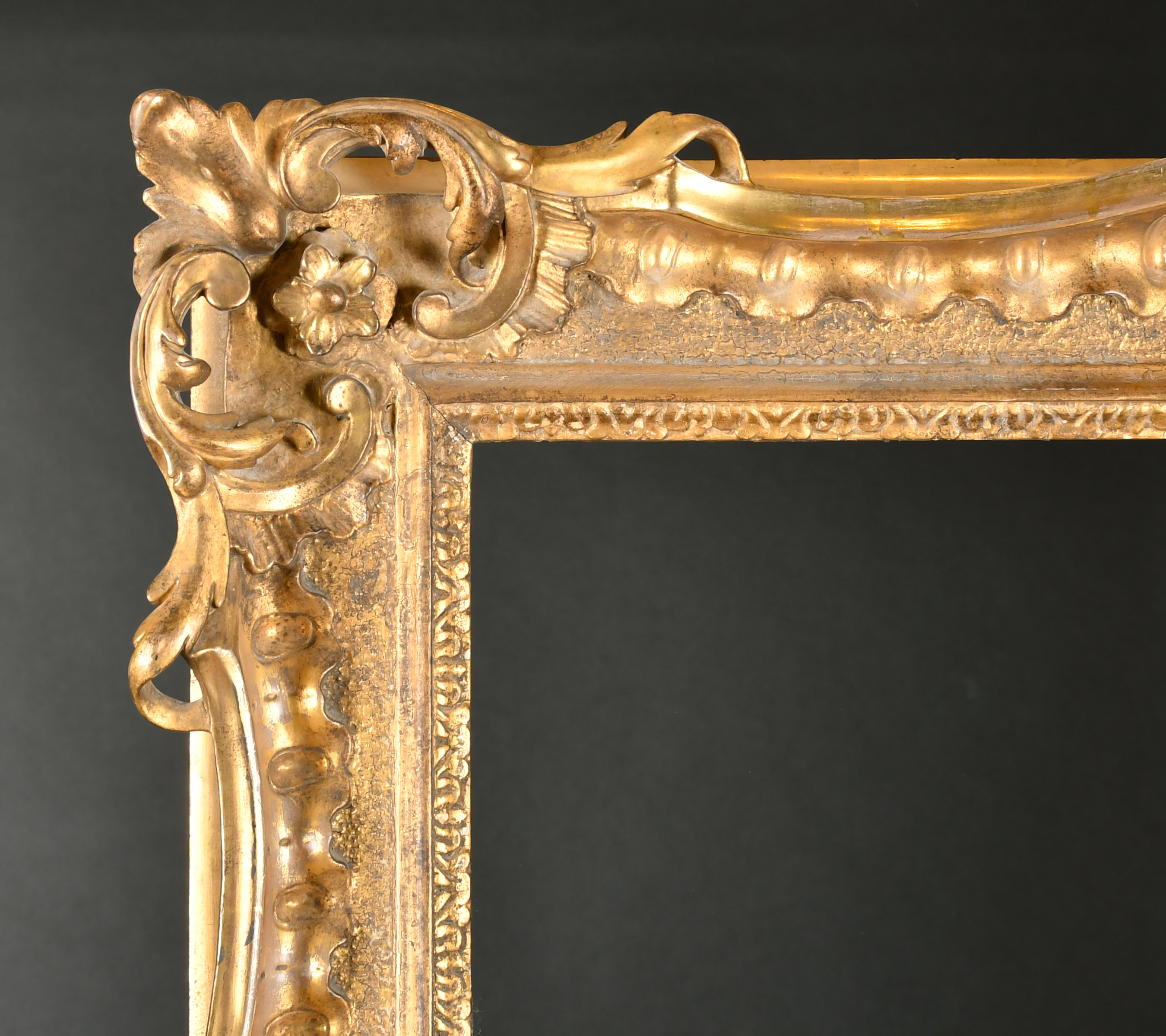 18th Century French School. A Carved Giltwood Chippendale Frame, with swept and pierced centres