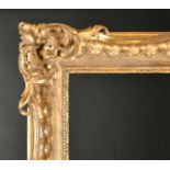 18th Century French School. A Carved Giltwood Chippendale Frame, with swept and pierced centres