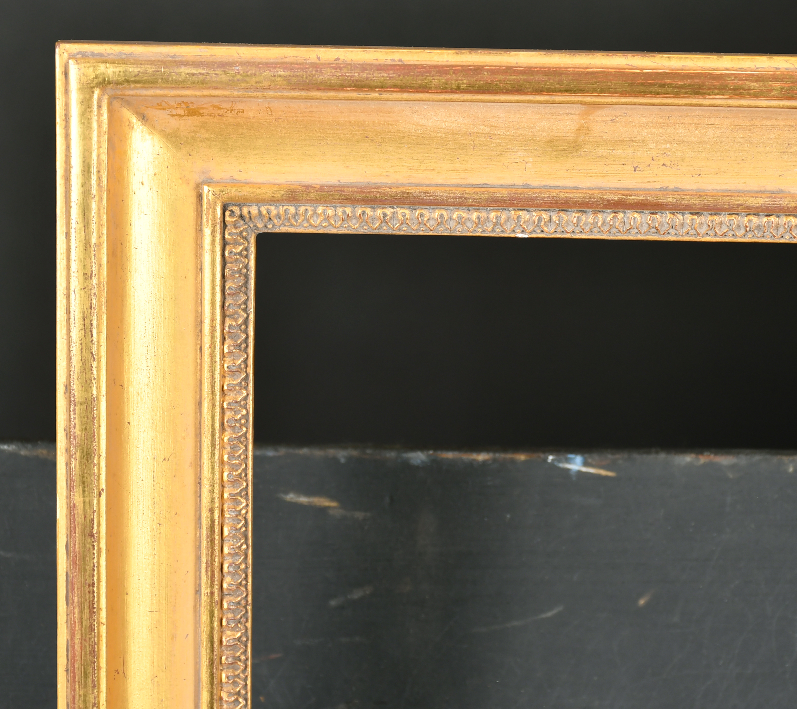 Alexander G Ley & Son. A Reproduction French Empire Giltwood Frame, with lambs tongue sight edge,