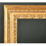 Alexander G Ley & Son. A Reproduction Carved Giltwood Frame, with a Carlo sight edge, rebate 24" x