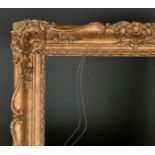 20th Century English School. A Gilt Composition Frame, with swept centres and corners, rebate 26"