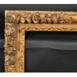18th Century French School. A Carved Giltwood Louis Frame, with swept corners, rebate 29" x 23.