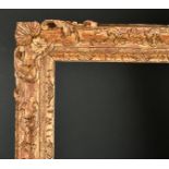 19th Century English School. A Carved Giltwood Frame, with swept and pierced centres and corners,