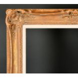 20th Century French School. A Gilt Composition Frame, with swept and pierced centres and corners,