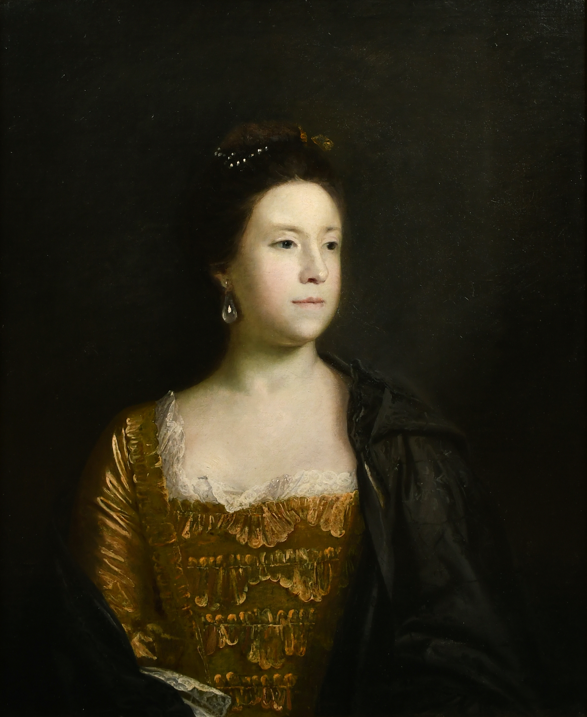 Joshua Reynolds (1723-1792) British. Portrait of Mrs Darley-Waddilove, half length wearing a gold