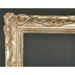 Early 20th Century English School. A Silver and Painted Composition Frame, with swept centres and