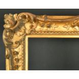 18th Century English School. A Carved Giltwood Frame, with swept and pierced centres and corners,