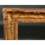 19th Century French School. A Louis Style Gilt Composition Frame, with swept and pierced centres and