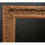 Early 20th Century European School A Gilt Composition Frame, with swept centres and corners, reb