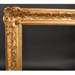 20th Century English School A Gilt Composition Frame, with swept and pierced centres and corners