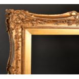 19th Century English School A Gilt Composition Frame, with swept centres and corners, rebate 50"