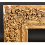 19th Century English School A Gilt Composition Frame, with swept centres and corners, rebate 35.