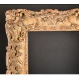 19th Century French School. A Carved Giltwood Frame, with swept centres and corners, rebate 30" x 25