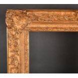 Early 20th Century French School. A Louis Style Gilt Composition Frame, with swept centres and corne