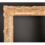18th Century French School. A Louis XV Carved Giltwood Frame (partially restored), with swept centre