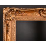 19th Century French School. A Painted Carved Wood Frame, with swept and pierced centres and corners,