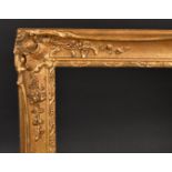 20th Century English School. A Painted Composition Frame, with swept centres and corners, rebate 48"