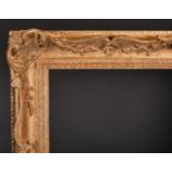 20th Century English School. A Gilt Composition Frame, with swept and pierced centres and corners,