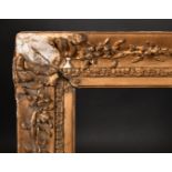 Early 19th Century English School. A Gilt Composition Frame with swept centres and corners, rebate