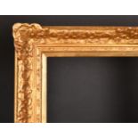 20th Century English School. A Gilt Composition Frame with swept centres and corners, rebate 30" x