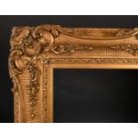 19th Century English School. A Gilt Composition Frame, with swept centres and corners, rebate 50"