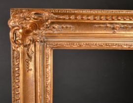 Early 20th Century European School. A Gilt Composition Frame, with swept centres and corners, rebate
