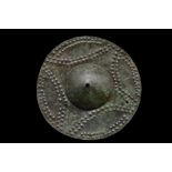 WESTERN ASIATIC DECORATED SHIELD UMBO SHIELD