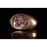 ROMAN CARNELIAN INTAGLIO WITH LEDA AND SWAN IN GOLD RING